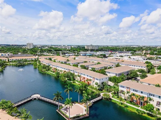 an aerial view of a city with lake view
