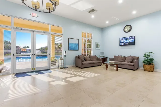 an aerial view of residential houses with outdoor space and parking