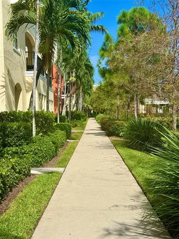 a sign that is sitting in front of flowers
