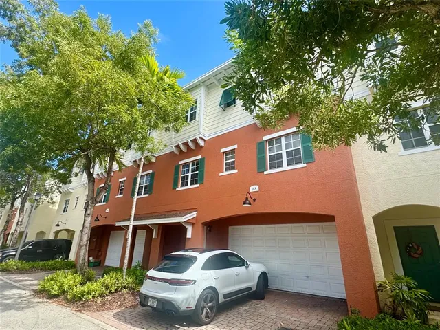 a view of swimming pool with a garden and plants