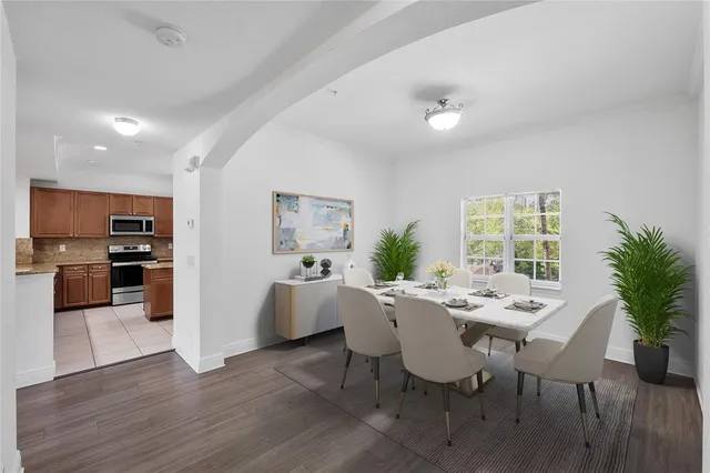 a view of a dining room with furniture and wooden floor