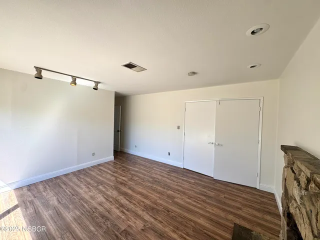 a view of room with hardwood floor