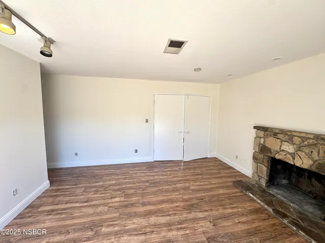 a view of room with hardwood floor