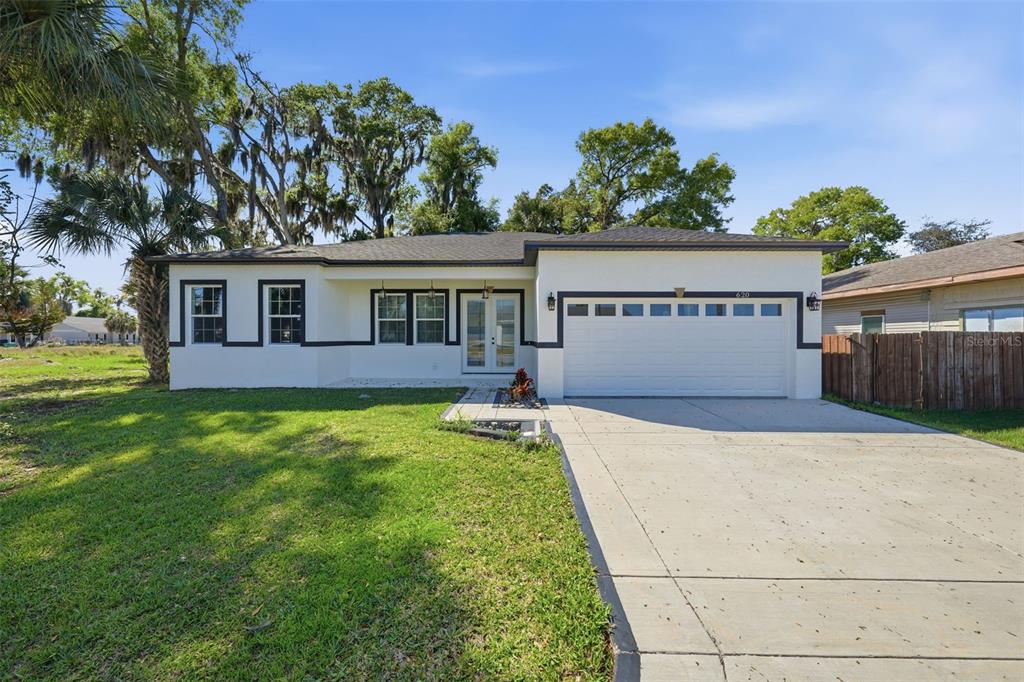 620 Titcomb Street Eustis, FL 32726 - Photo 2 of 30 a front view of a house with a yard