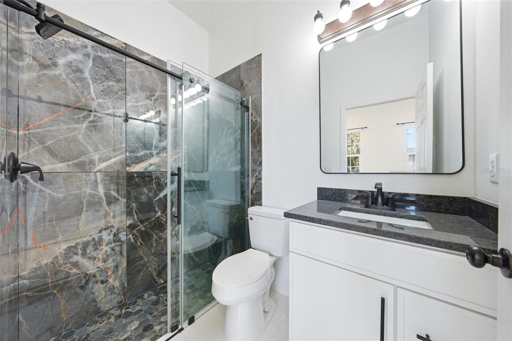 620 Titcomb Street Eustis, FL 32726 - Photo 21 of 30 a bathroom with a sink toilet and shower