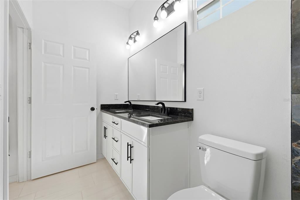 620 Titcomb Street Eustis, FL 32726 - Photo 24 of 30 a bathroom with a sink and a toilet