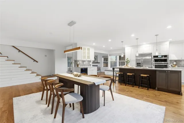 a kitchen with a table and chairs in it