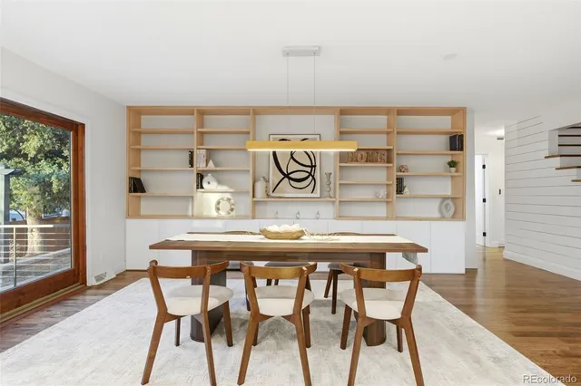 a kitchen with a table and chairs in it