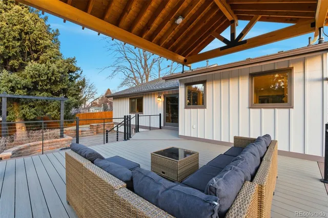 a view of backyard with sitting area