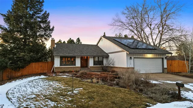 a view of a terrace with a table and chairs