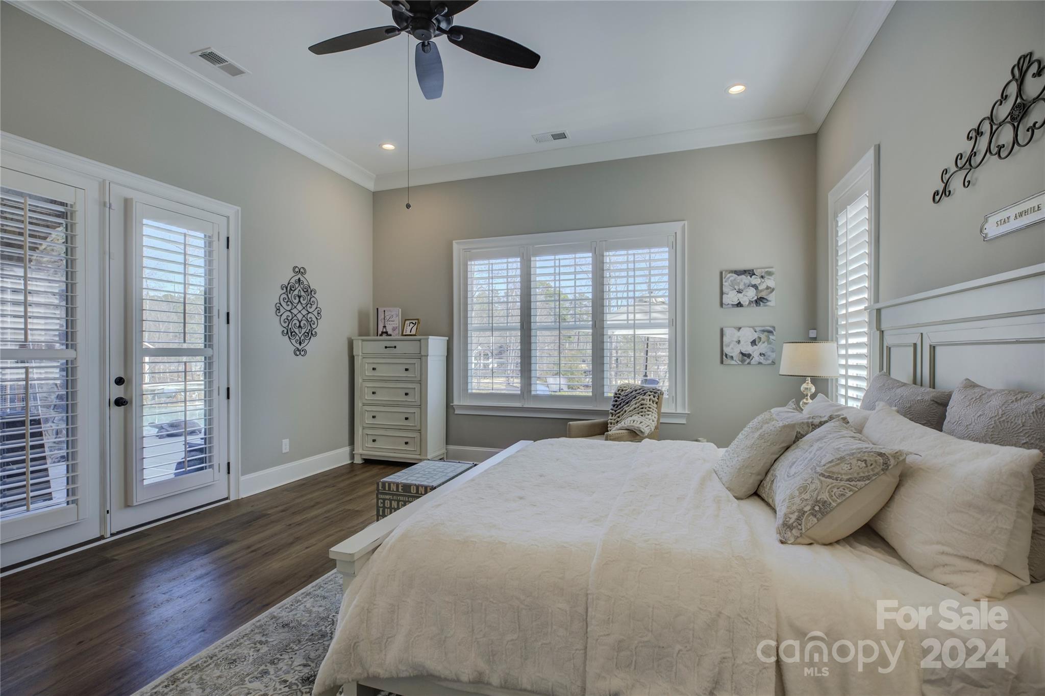 2001 Bessbrook Road Fort Mill, SC 29708 - Photo 42 of 48 a bedroom with a large bed and a chandelier