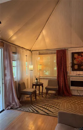 a view of a dining room with furniture and window