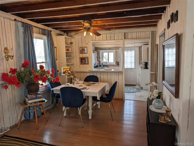 a dining room with furniture and window