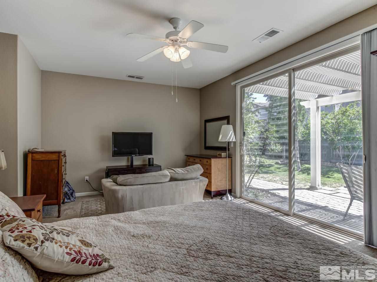 560 Secretariat Court Reno, NV 89521 - Photo 17 of 25 a living room with furniture and a flat screen tv