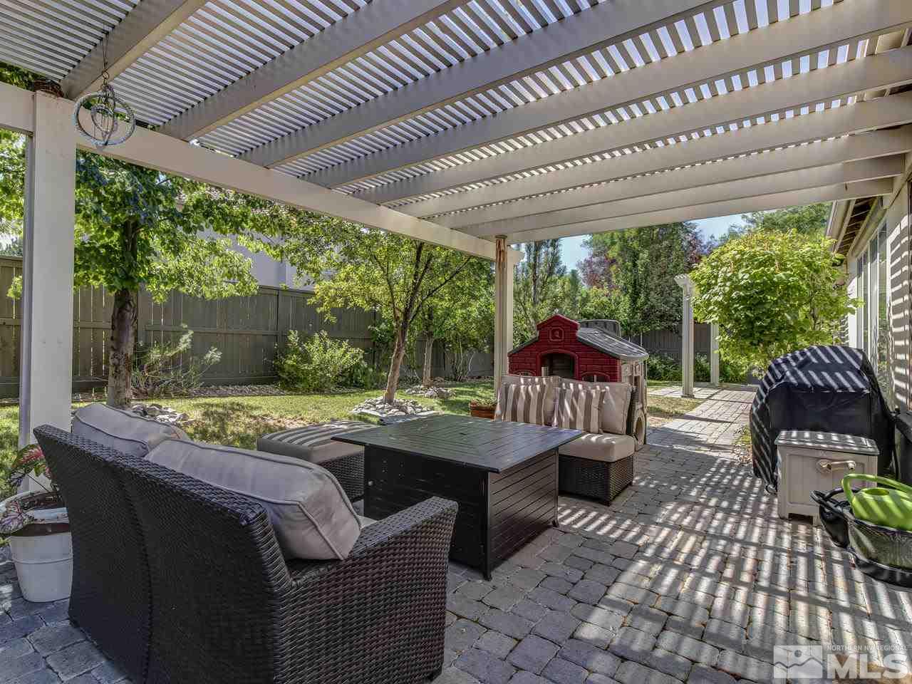 560 Secretariat Court Reno, NV 89521 - Photo 24 of 25 a outdoor patio with swimming pool table and chairs