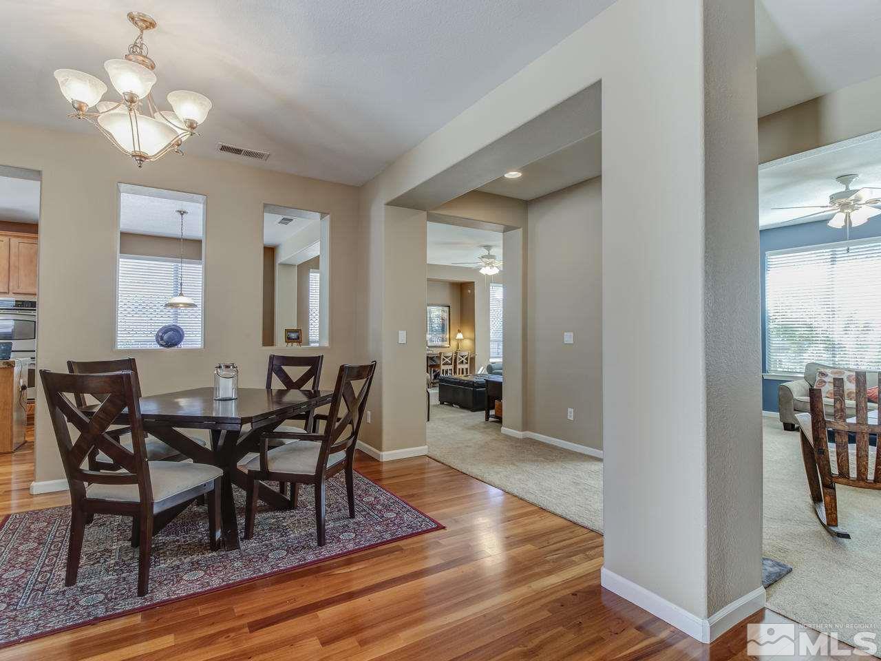 560 Secretariat Court Reno, NV 89521 - Photo 4 of 25 a view of a dining room with furniture and wooden floor