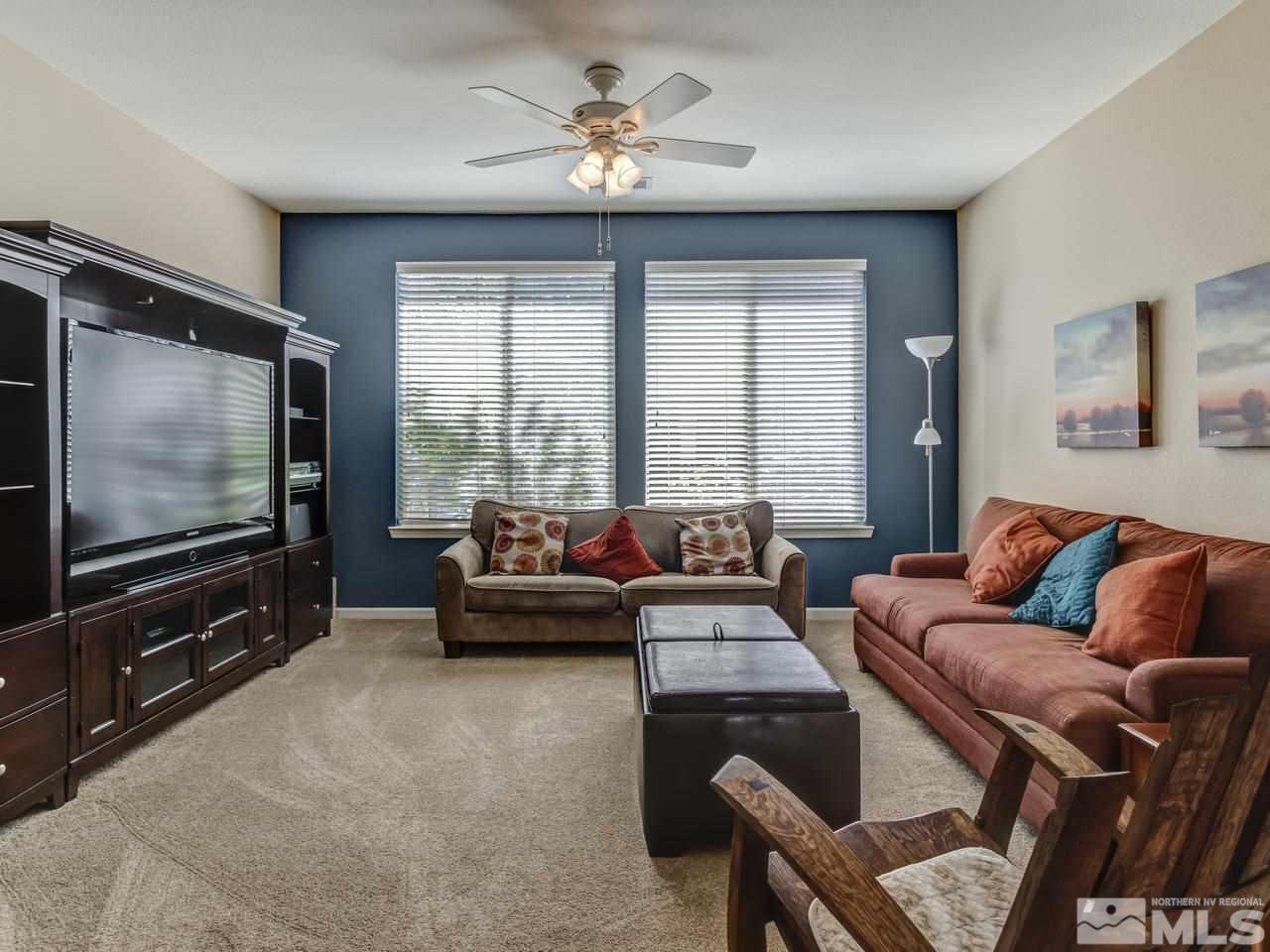 560 Secretariat Court Reno, NV 89521 - Photo 6 of 25 a living room with furniture and a flat screen tv