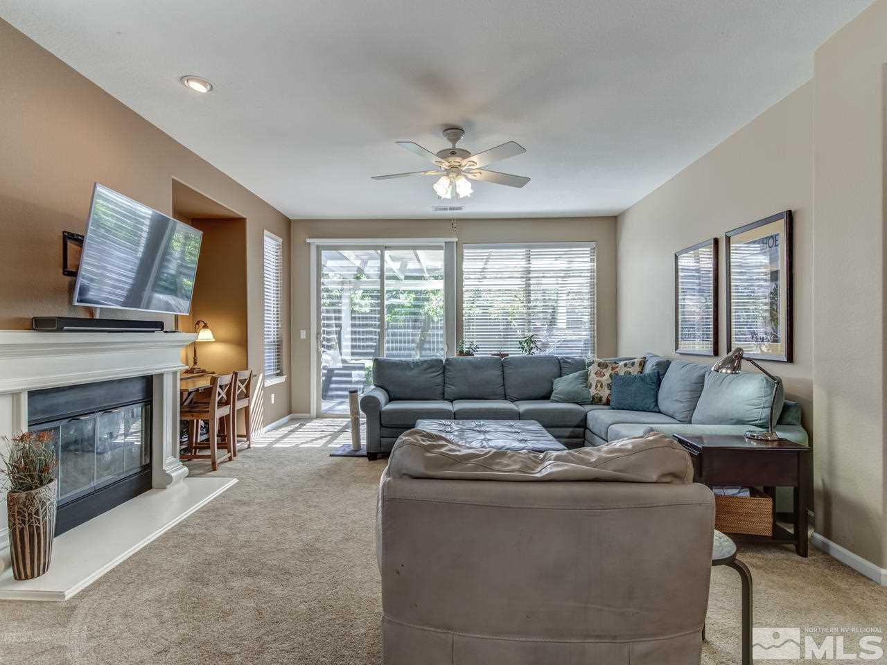 560 Secretariat Court Reno, NV 89521 - Photo 9 of 25 a living room with furniture and a fireplace