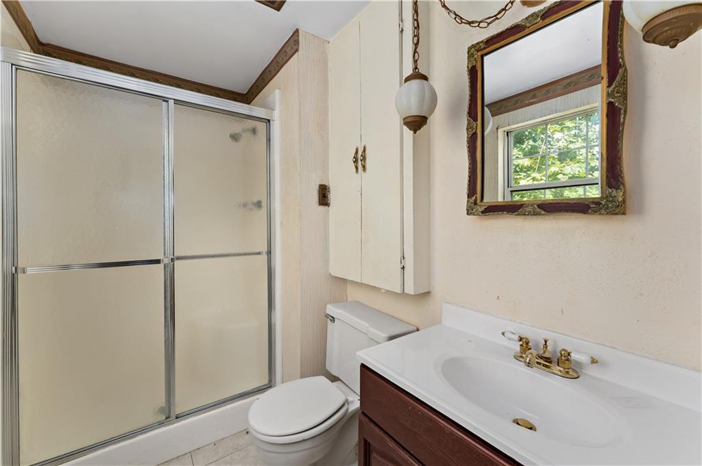 216 Catalpa Place Pittsburgh, PA 15228 - Photo 15 of 43 a bathroom with a sink mirror vanity and toilet