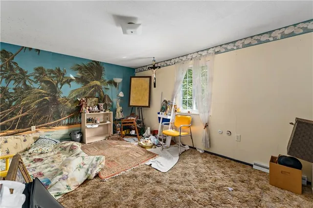 a room with furniture and a flat screen tv