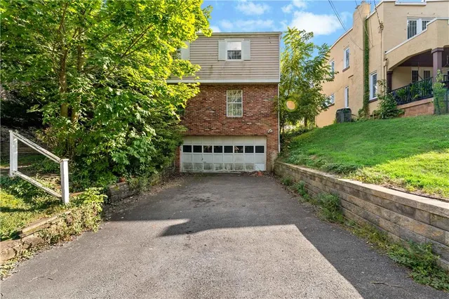 a view of a house with a tree
