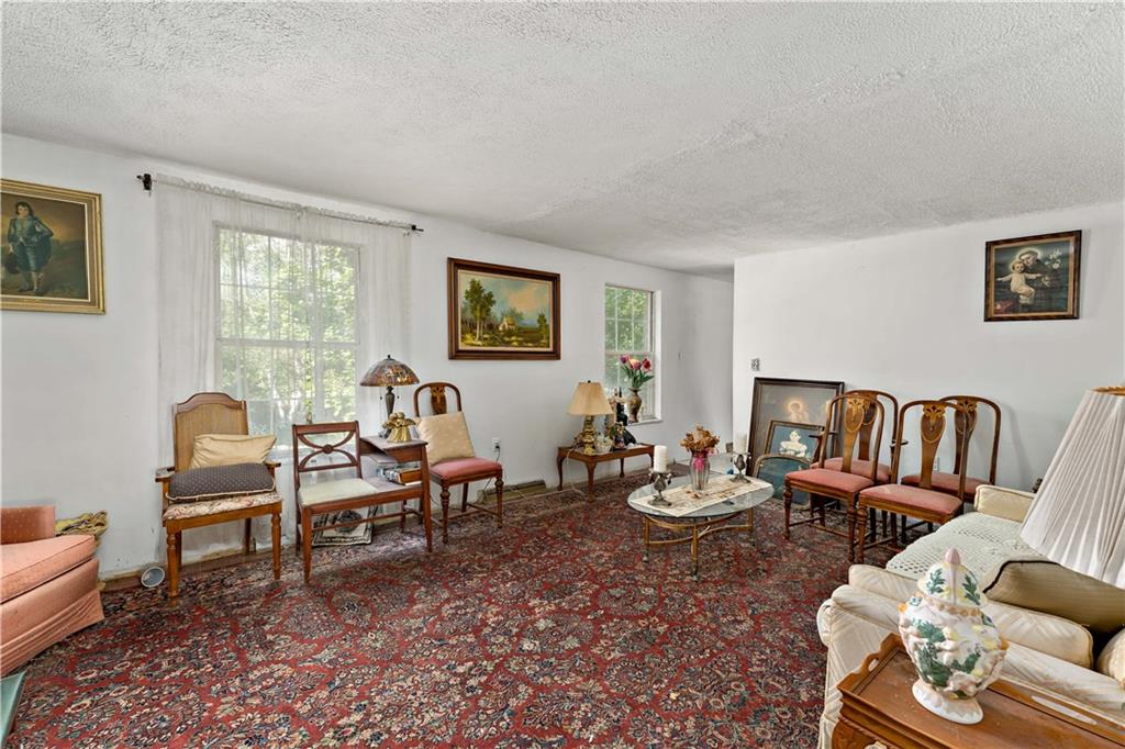 216 Catalpa Place Pittsburgh, PA 15228 - Photo 7 of 43 a living room with furniture kitchen view and a window