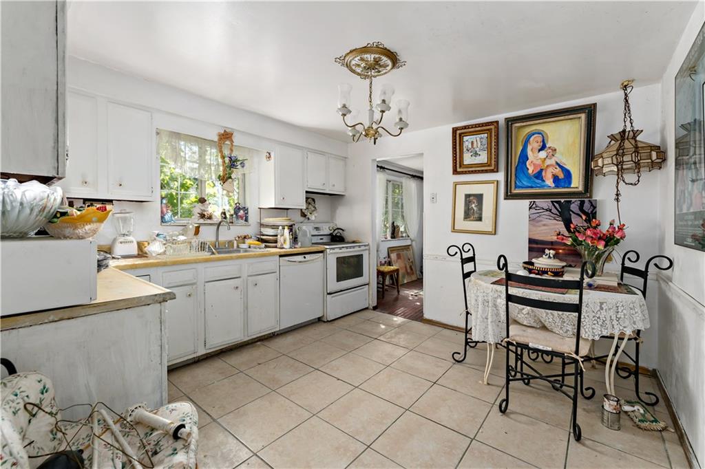 216 Catalpa Place Pittsburgh, PA 15228 - Photo 8 of 43 a kitchen with stainless steel appliances kitchen island granite countertop a sink and cabinets