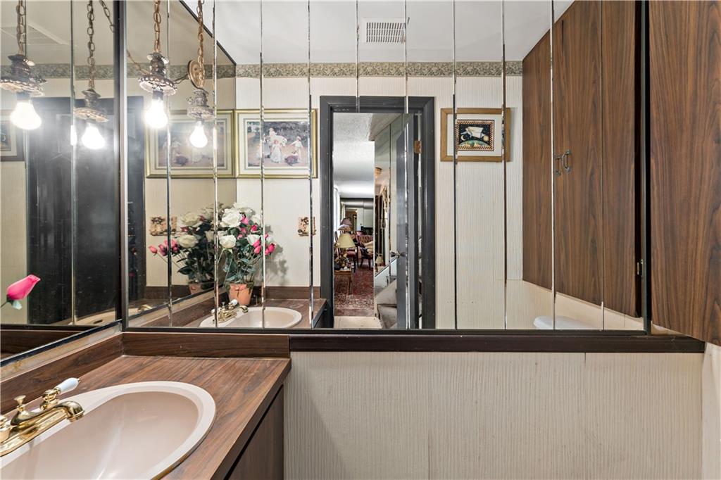 216 Catalpa Place Pittsburgh, PA 15228 - Photo 10 of 43 a bathroom with a sink and a mirror