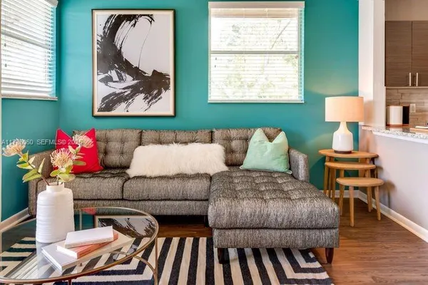 a living room with furniture and a window