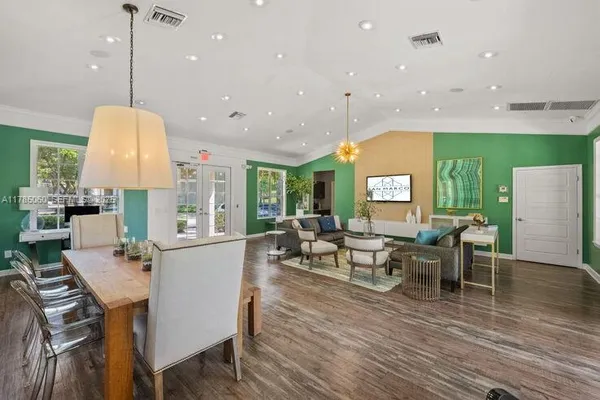 a living room with furniture a window and appliances