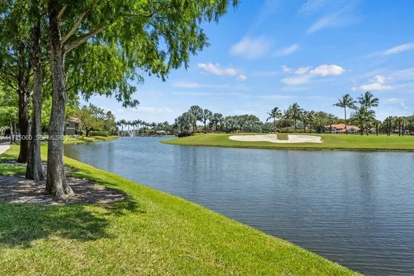 a view of a lake with a big yard