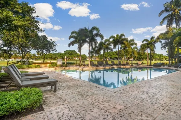 a view of swimming pool with outdoor seating