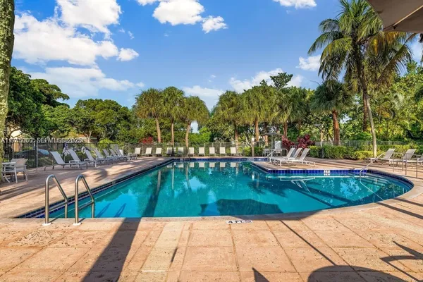 a view of a swimming pool with a patio