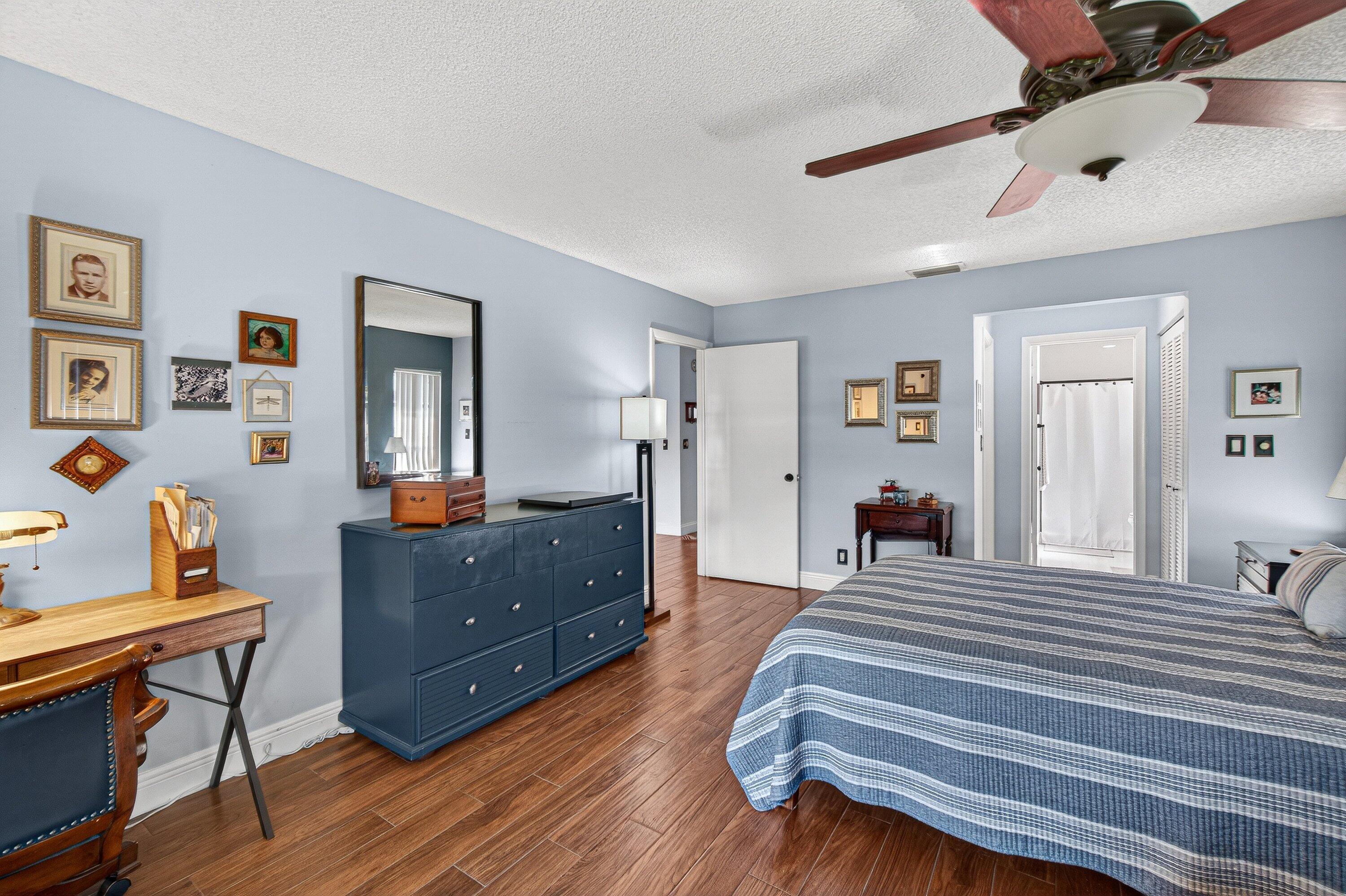 13465 Fishtail Palm Court, Unit D Delray Beach, FL 33484 - Photo 16 of 29 a living room with furniture and a wooden floor