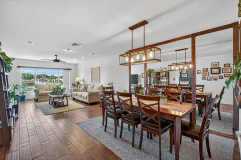a view of a dining room with furniture window and outside view