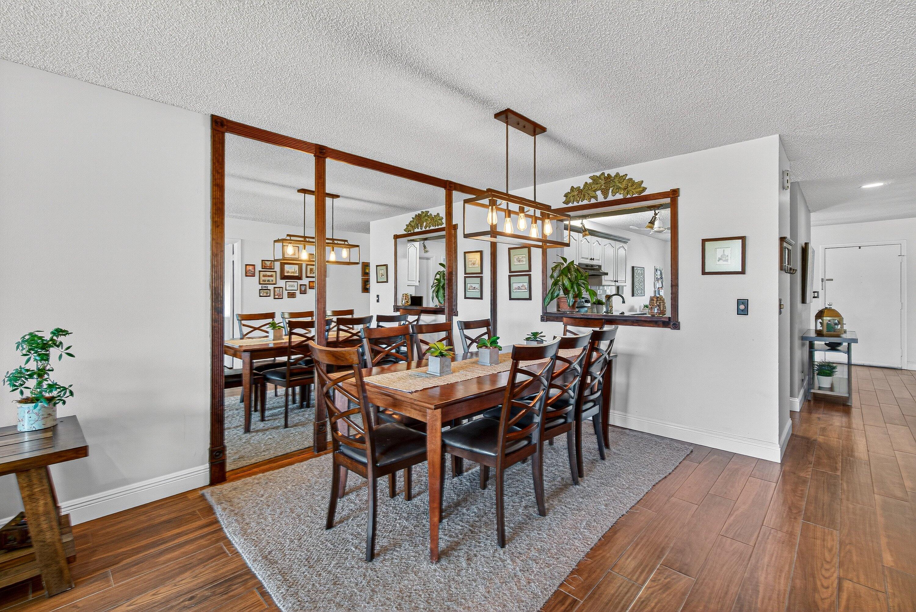 13465 Fishtail Palm Court, Unit D Delray Beach, FL 33484 - Photo 9 of 29 a view of a dining room with furniture window and wooden floor