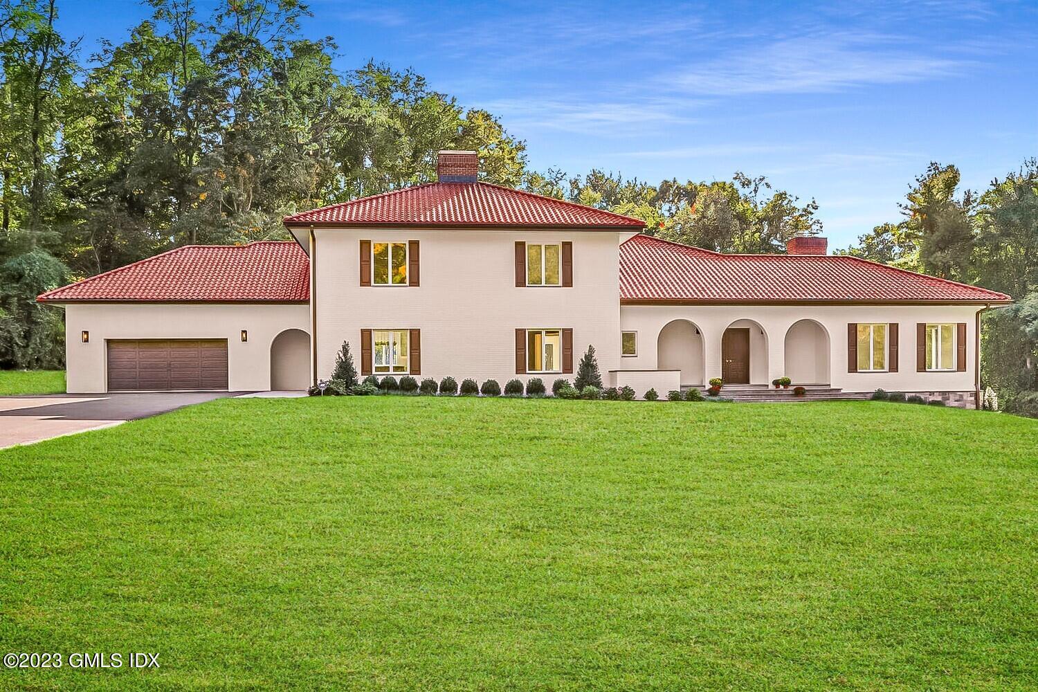 a aerial view of a house with a yard