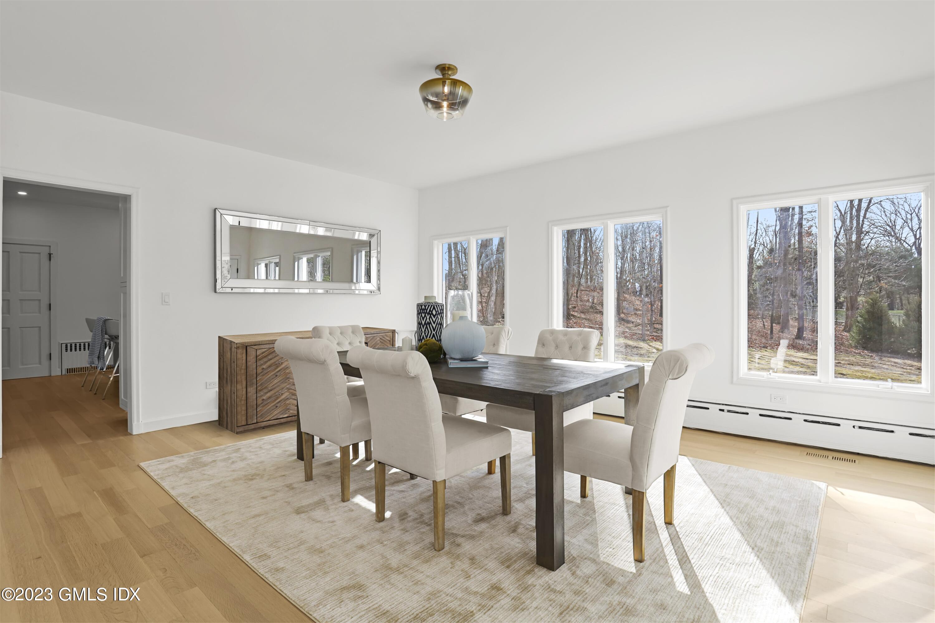 10 Harkim Road Greenwich, CT 06831 - Photo 14 of 39 a view of a dining room with furniture and wooden floor