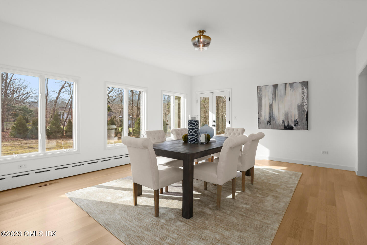 10 Harkim Road Greenwich, CT 06831 - Photo 15 of 39 a view of a dining room with furniture and wooden floor