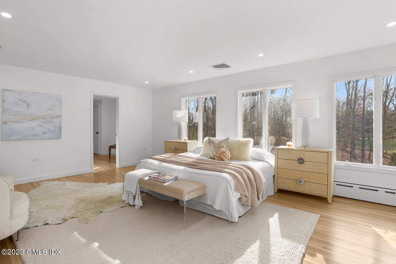 10 Harkim Road Greenwich, CT 06831 - Photo 19 of 39 a bedroom with a bed and a large window