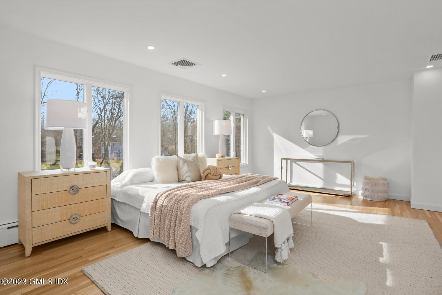 10 Harkim Road Greenwich, CT 06831 - Photo 21 of 39 a bedroom with a bed and a mirror on the dresser