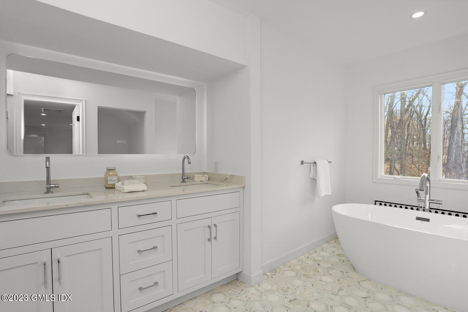 10 Harkim Road Greenwich, CT 06831 - Photo 22 of 39 a bathroom with a granite countertop sink mirror and bathtub