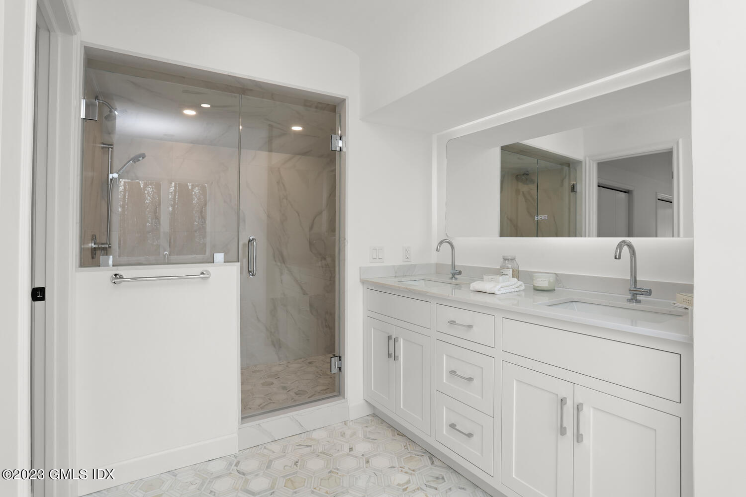 10 Harkim Road Greenwich, CT 06831 - Photo 23 of 39 a bathroom with a granite countertop sink two mirror and shower