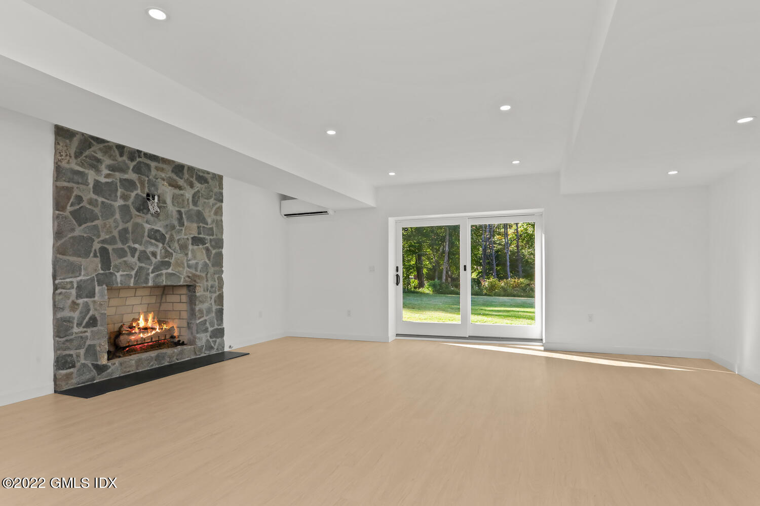10 Harkim Road Greenwich, CT 06831 - Photo 28 of 39 a view of an empty room with a window and fire place