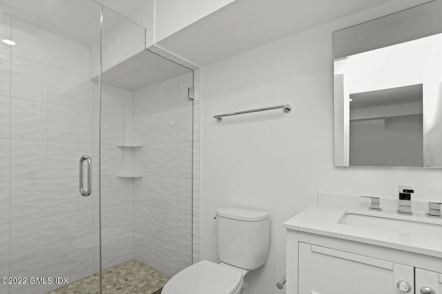 10 Harkim Road Greenwich, CT 06831 - Photo 29 of 39 a bathroom with a toilet sink vanity and shower