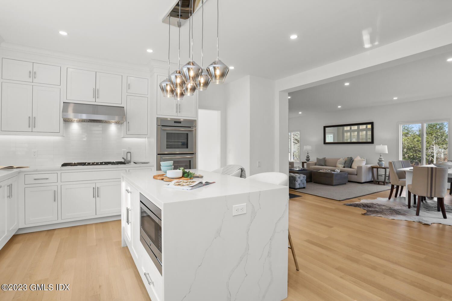 10 Harkim Road Greenwich, CT 06831 - Photo 3 of 39 a kitchen that has a lot of cabinets in it and wooden floors