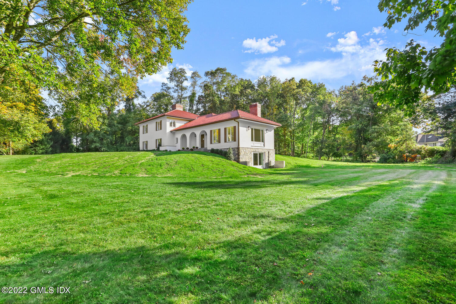 10 Harkim Road Greenwich, CT 06831 - Photo 31 of 39 a house view with a garden space