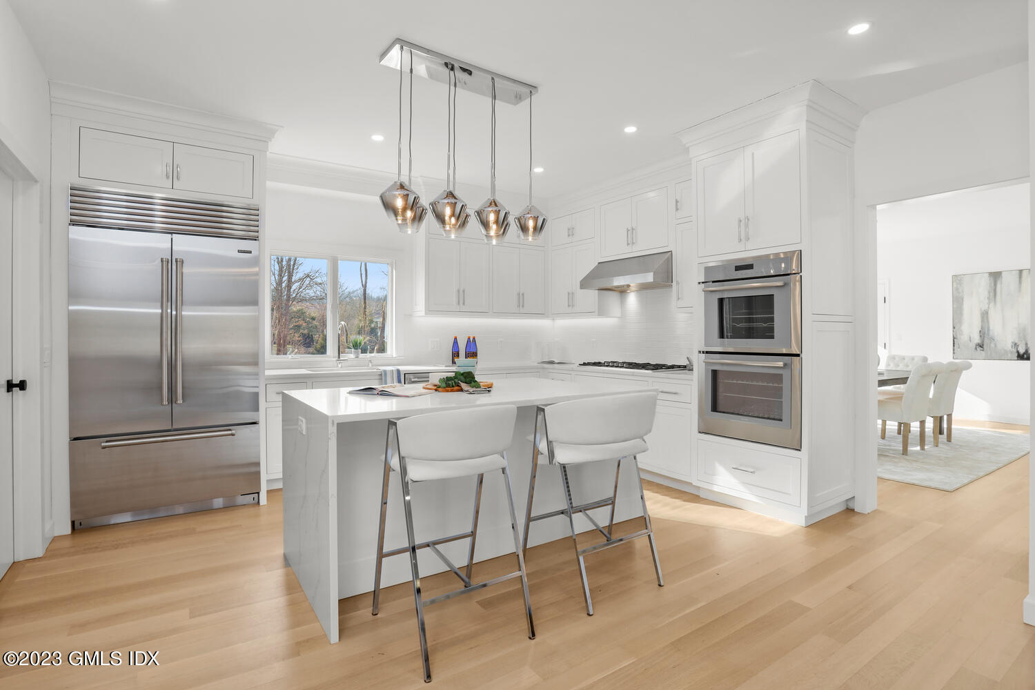 10 Harkim Road Greenwich, CT 06831 - Photo 4 of 39 a kitchen with stainless steel appliances kitchen island granite countertop a refrigerator and a stove top oven