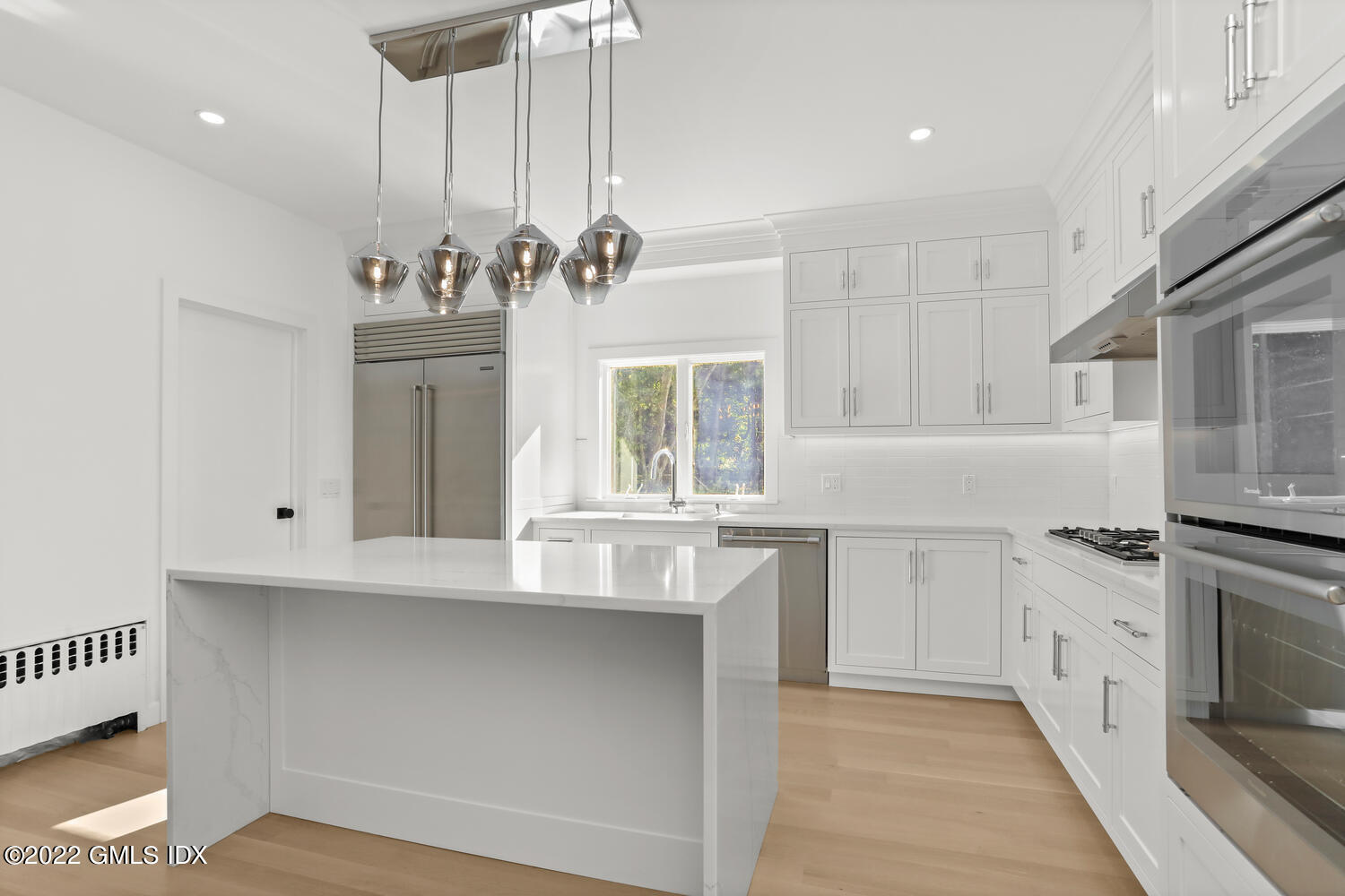 10 Harkim Road Greenwich, CT 06831 - Photo 6 of 39 a kitchen with granite countertop a stove a sink and cabinets