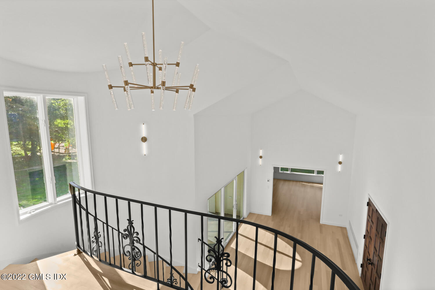 10 Harkim Road Greenwich, CT 06831 - Photo 9 of 39 a view of a hallway with windows and stairs